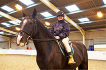 A happy Harrow resident, Robin Blake, horse riding