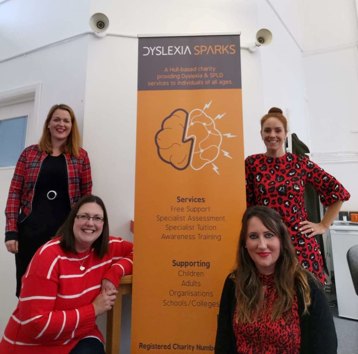 Dyslexia Sparks specialist teachers and assessors wearing red.